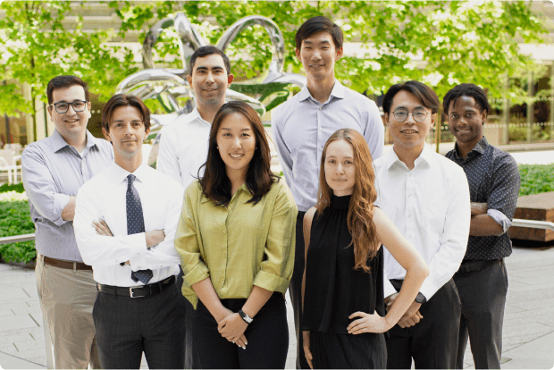 A group of staff members smiling for a photo.