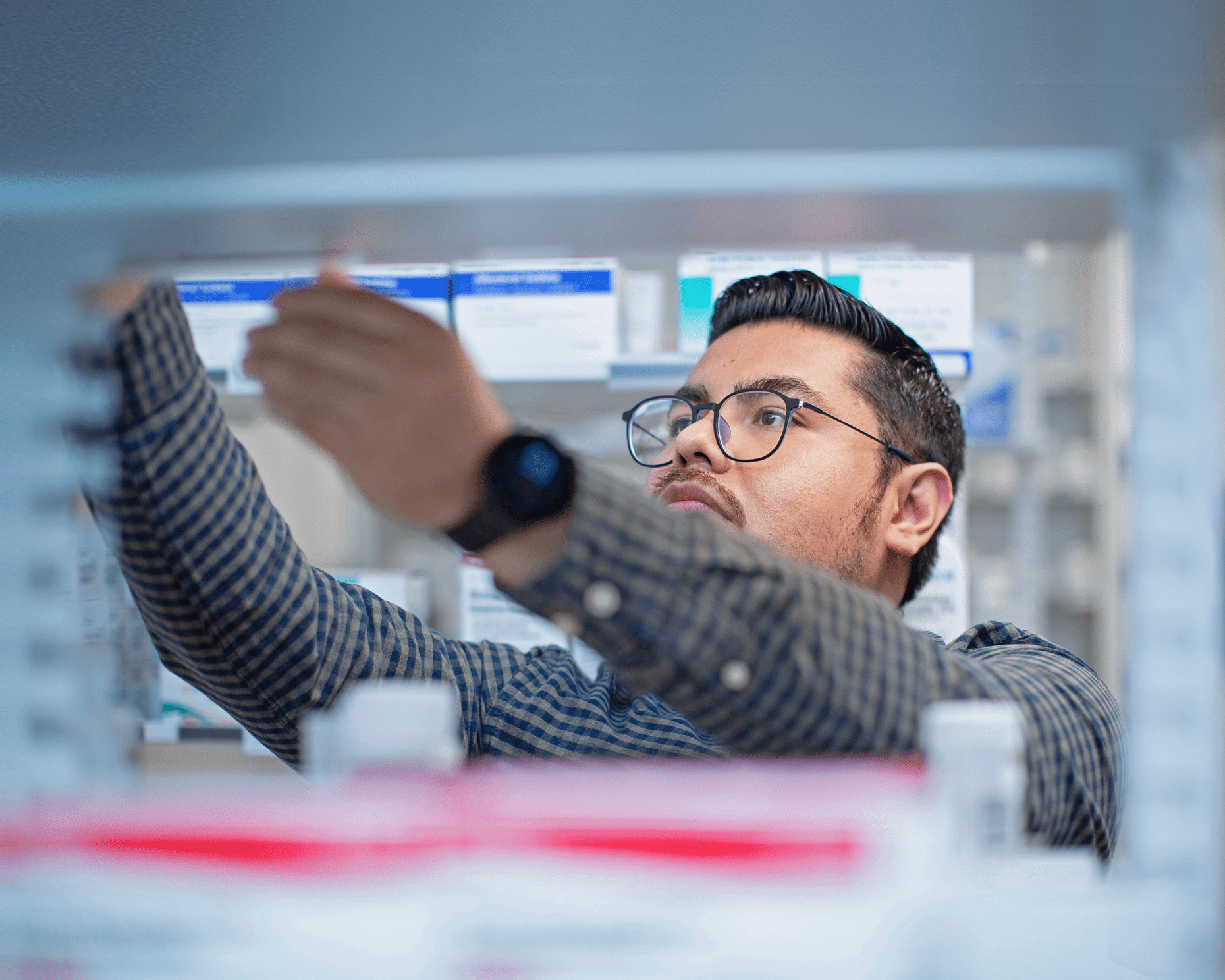 A male staff member at NYU Langone working in a laboratory.